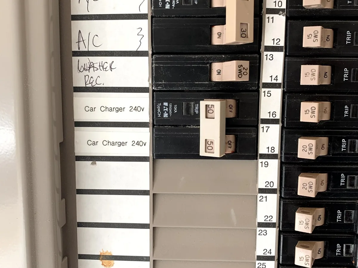 Panel breakers labeled “Car Charger 240v” beside the A/C and washer circuits
