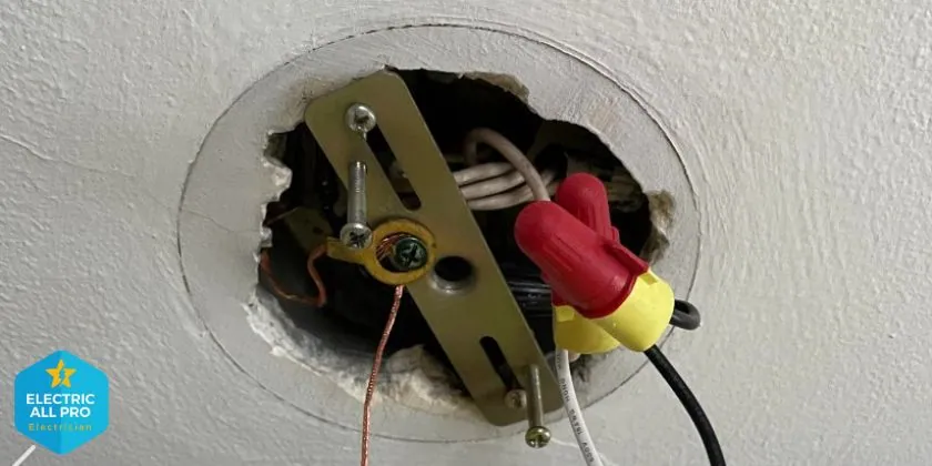 Burnt, loose wiring connections behind a light fixture