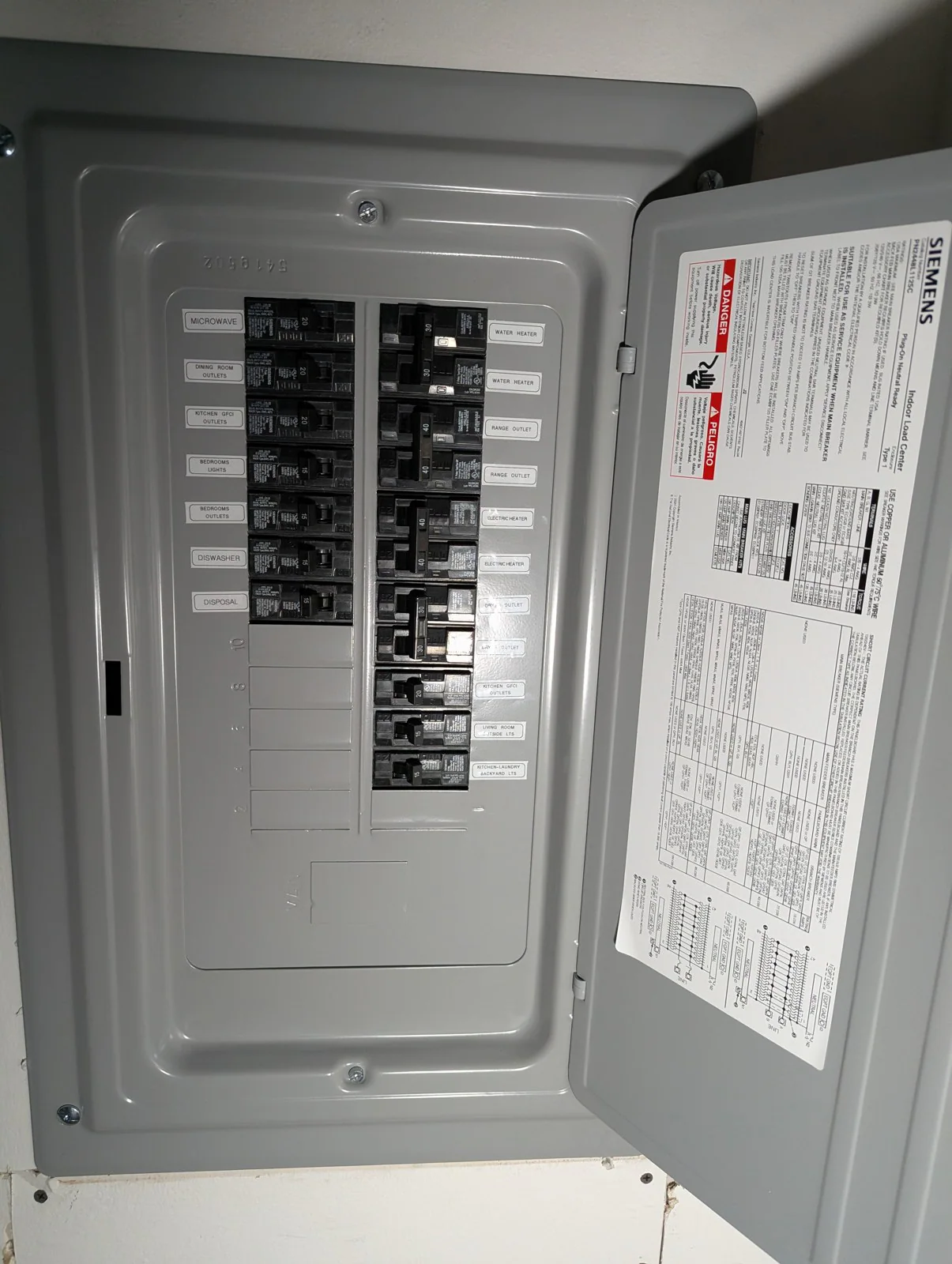Open electrical panel with labeled breakers and a Siemens brand label, in Hayes Barton, Raleigh