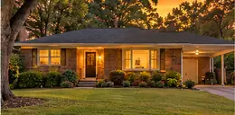 Mid-century brick ranch house with a lawn