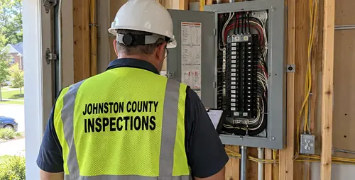 Johnston County inspector checking an electrical panel
