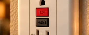 GFCI outlet with test and reset buttons