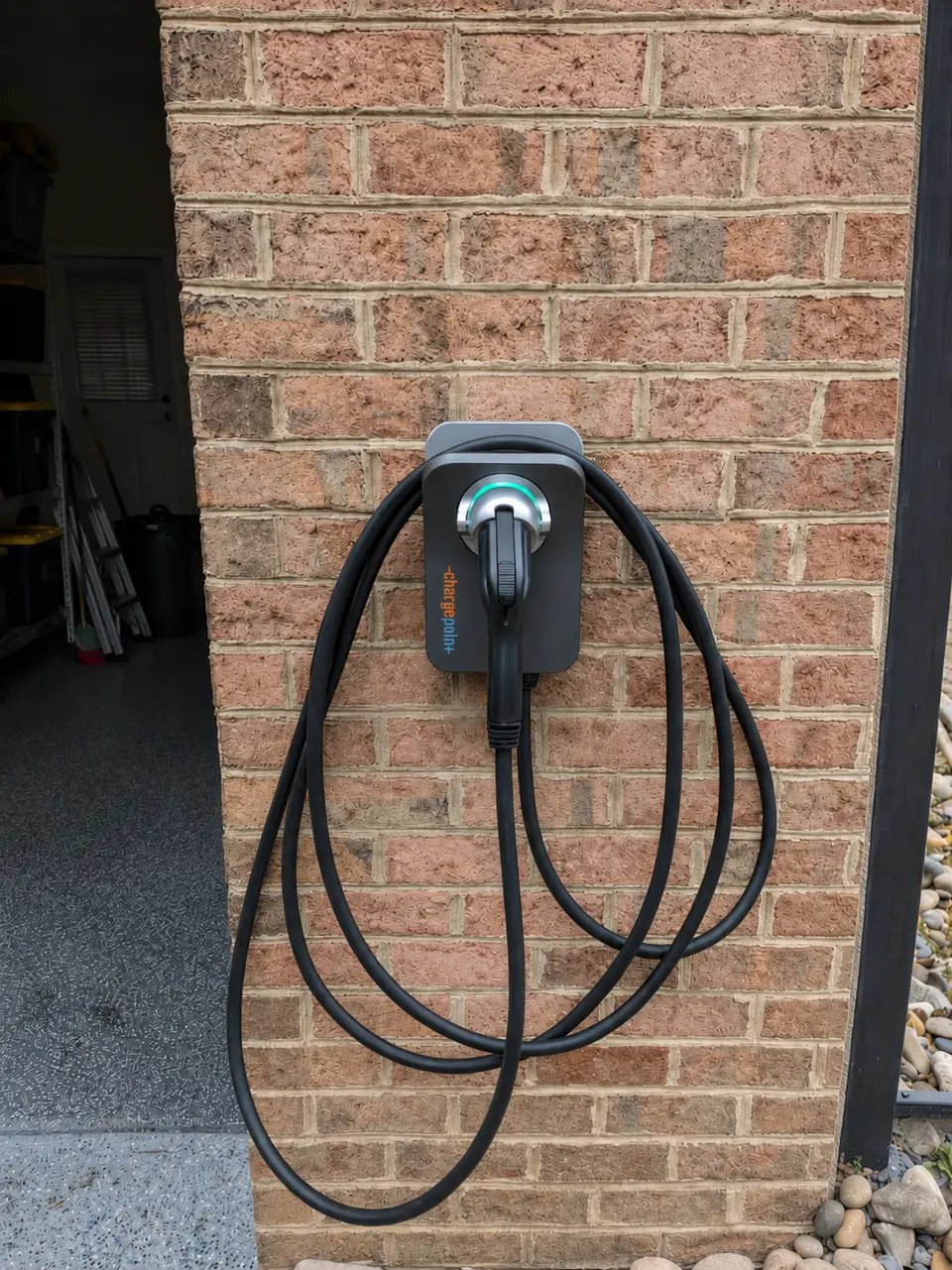 Level 2 charger mounted on garage wall with EV charging — Level 2 EV Charger Installation — Brier Creek, Raleigh NC