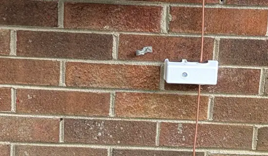 InterSystem bonding terminal and copper bonding conductor installed beside a 200 amp electrical panel in Raleigh, NC