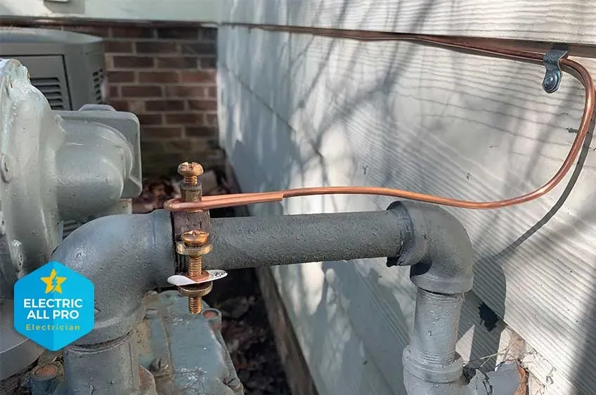 CSST gas line bonding clamp and copper conductor installed by Electric All Pro at a Raleigh home