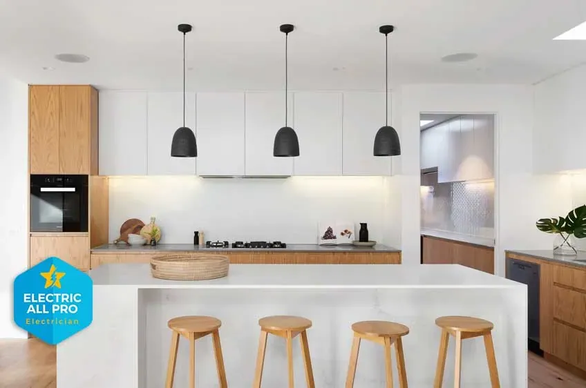 Three pendants hung over a kitchen island in a Raleigh home