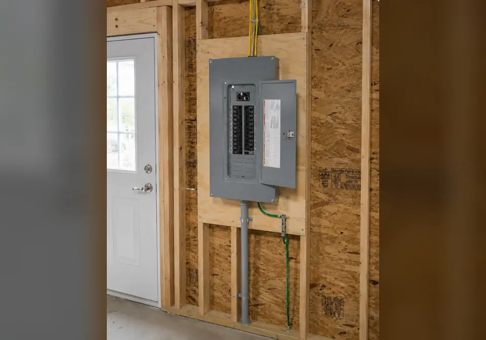 Open subpanel installed in a garage