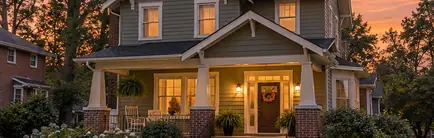 Early 1900s Craftsman-era building on a small-town main street at dusk
