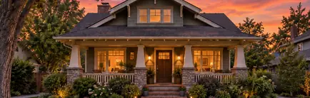 Early 1900s Craftsman house with a deep front porch on a tree-lined street