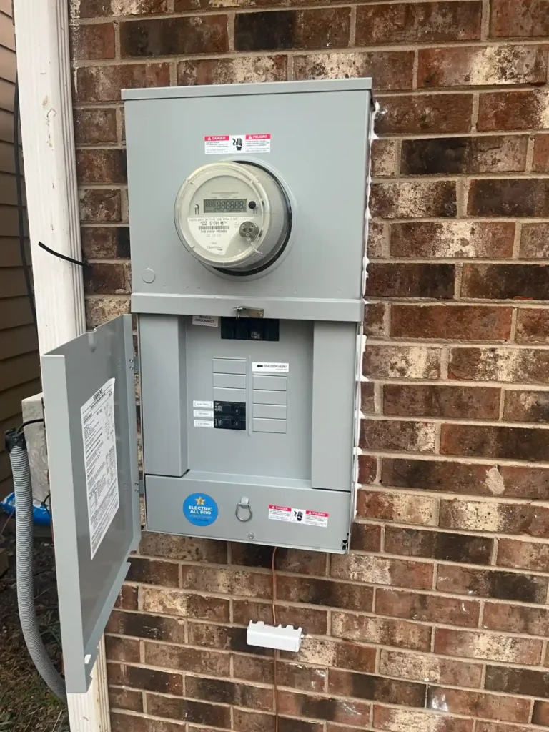 New Exterior Electrical Meter And 200-Amp Panel Installed On Brick Wall After Electrical Service Upgrade In Raleigh, Nc.