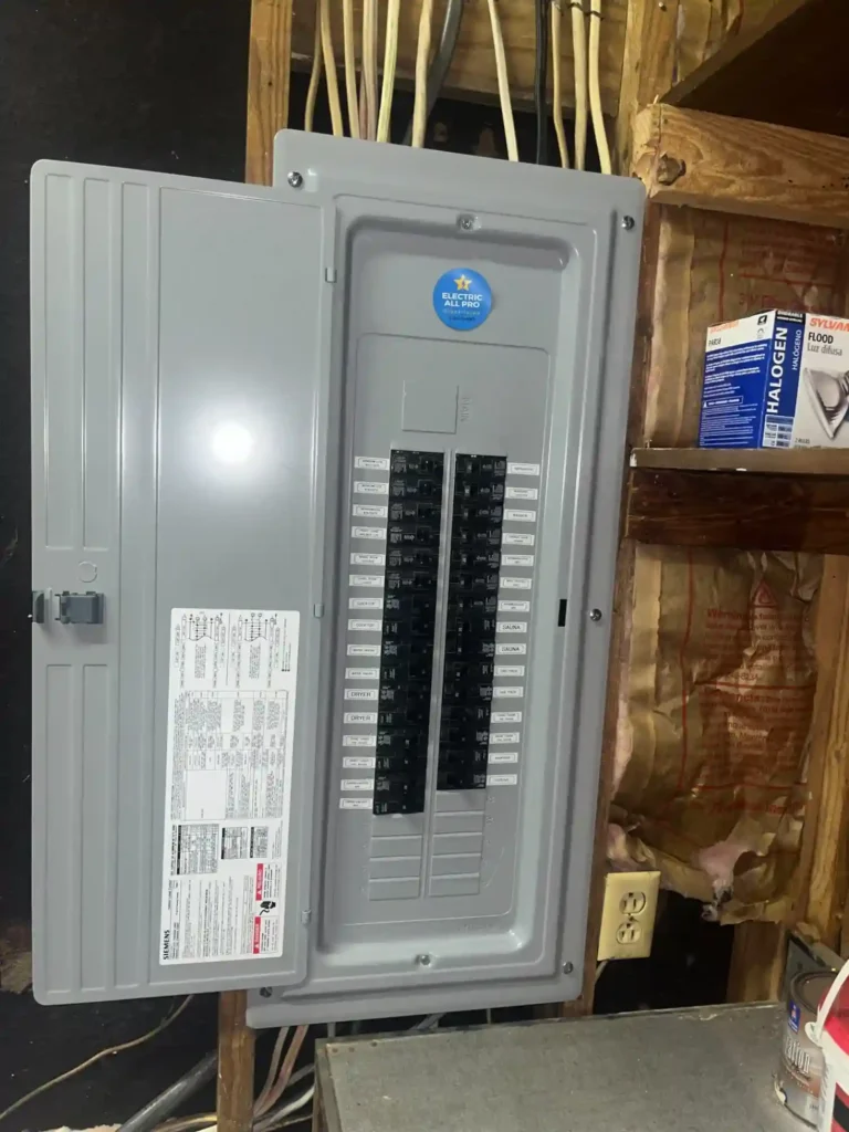 New Interior Electrical Subpanel Installed In Basement With Organized Wiring And Labeled Breakers.